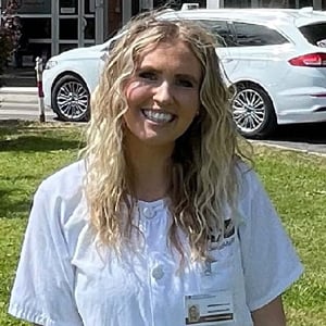 Brooke Baldwin, a blonde BYU nursing student, standing outside
